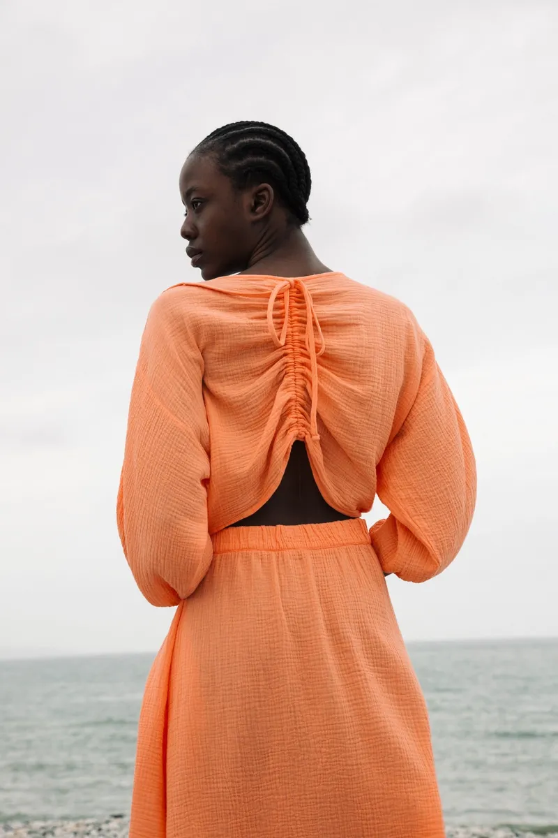 Ezili Organic Cotton Dress in Apricot by HANNAH BEAUMONT 3